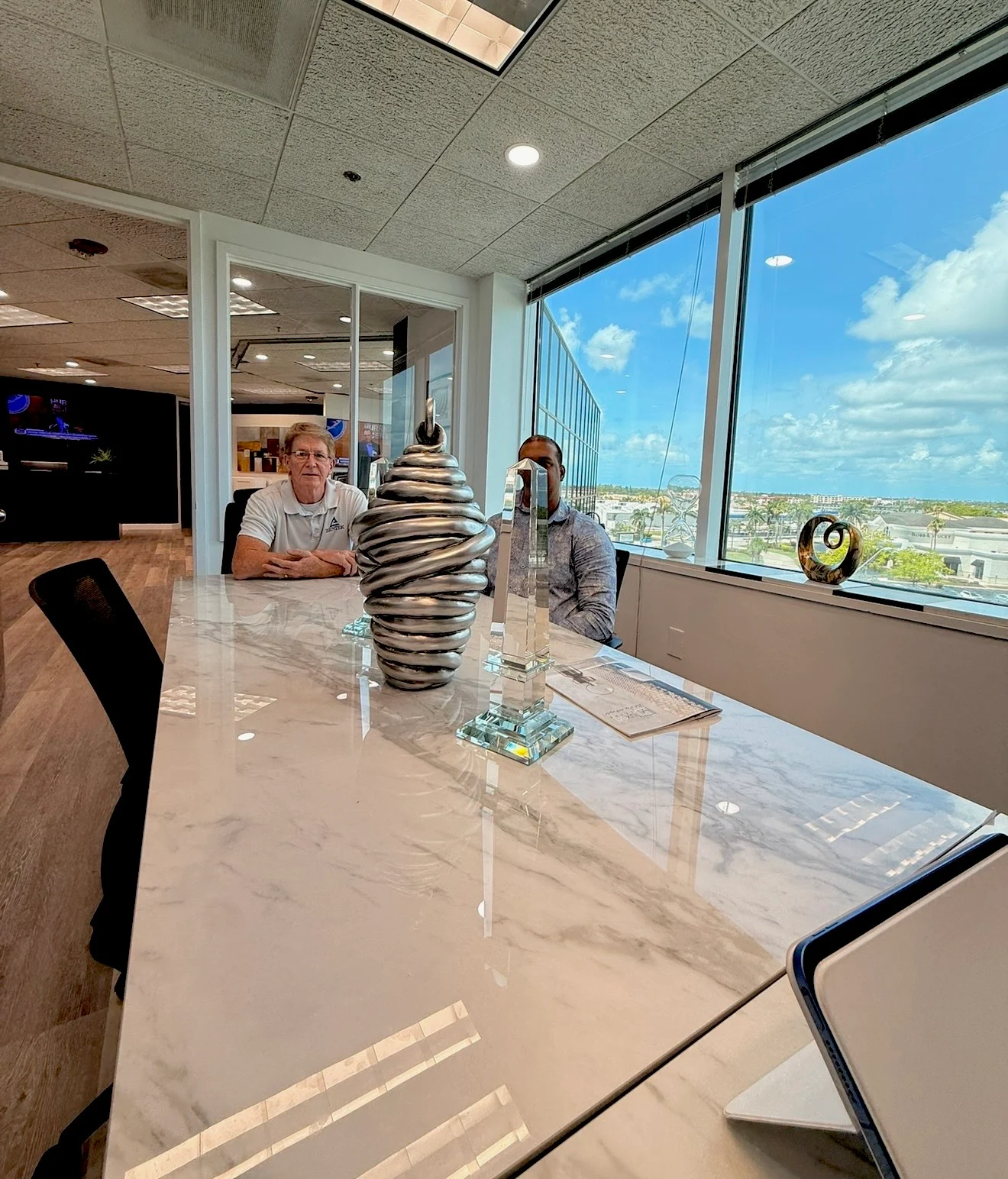 A project conversation inside the ZenTek Homes Fort Myers office