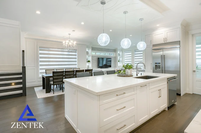 Bright ZenTek kitchen and bath renovation with white cabinetry and connected living space